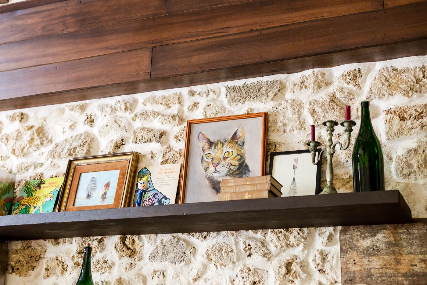 Wooden shelving and stone walls create a rustic ambiance in an event space.
