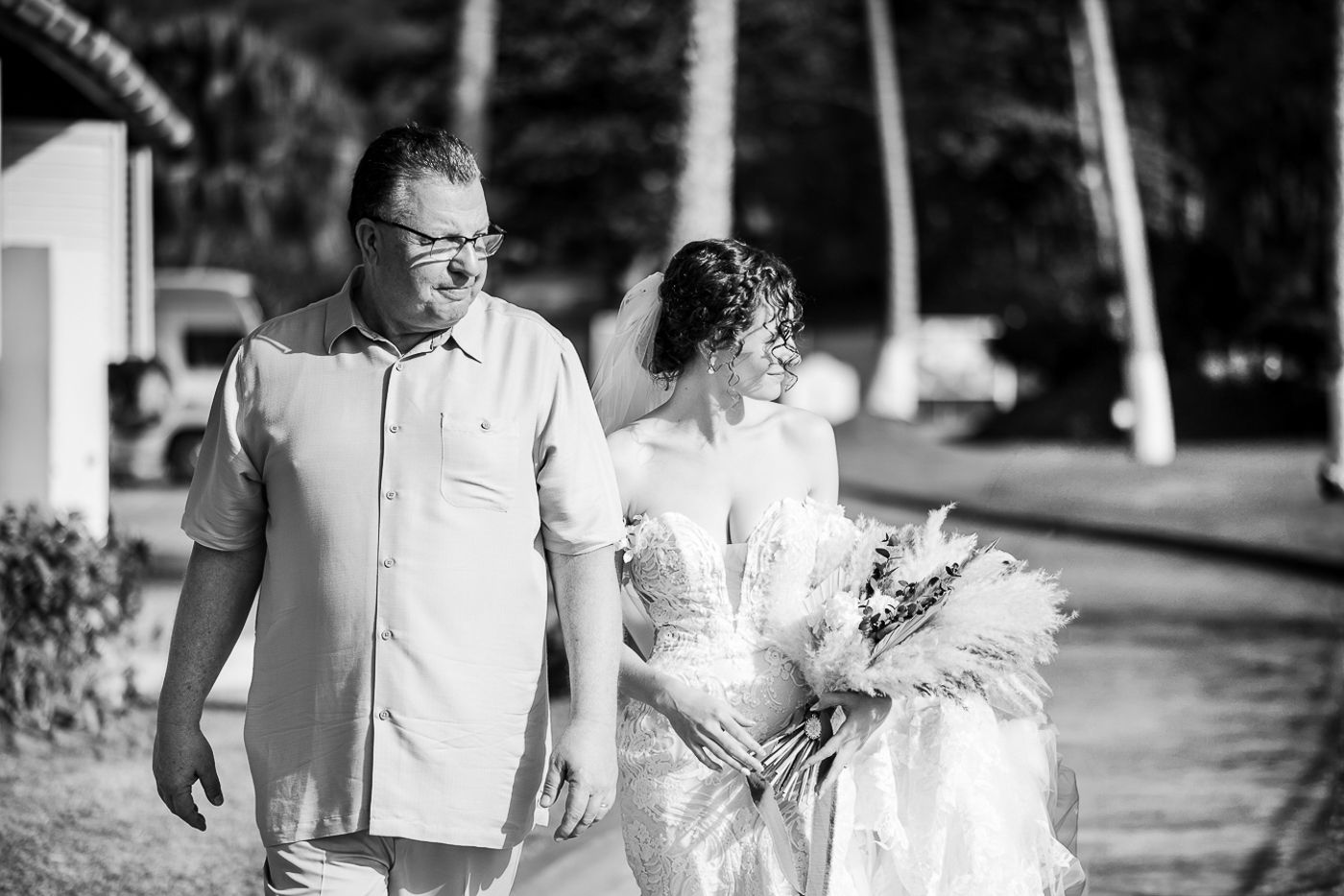 Black and white wedding party photos captured outdoors with natural lighting.
