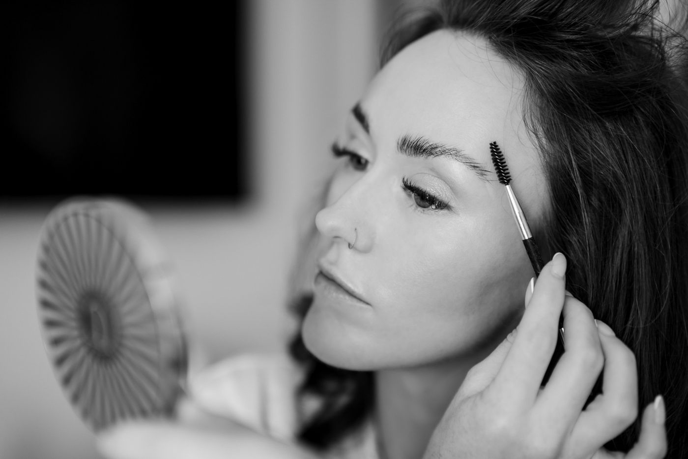 Black and white portrait series showing various expressions.