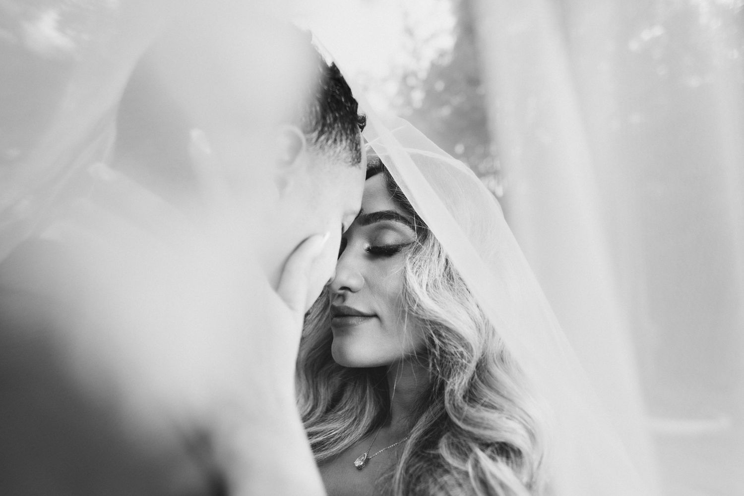 A series of black and white artistic profile portraits showing long blonde hair and dramatic lighting effects.