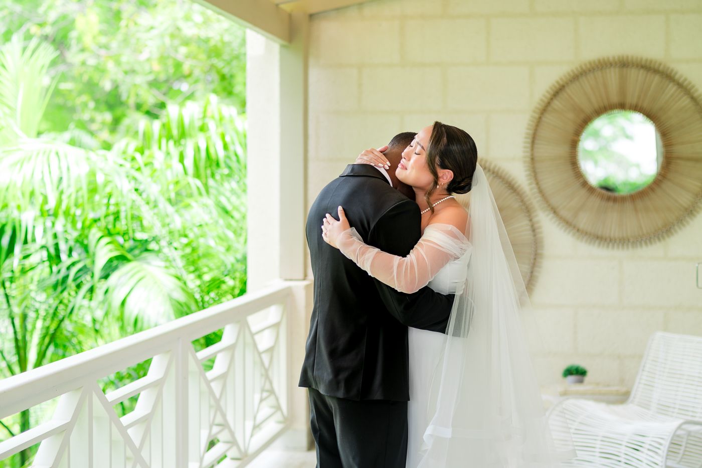 A romantic exchange takes place on a sunlit veranda with decorative wall accents.