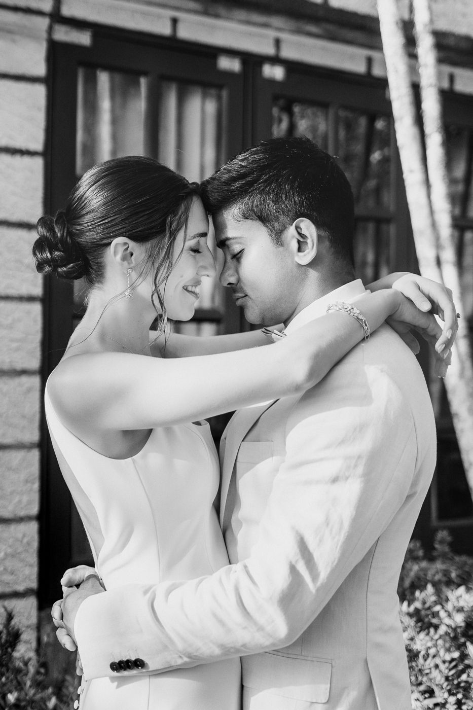 Black and white romantic portraits showing tender embraces between the newlyweds.
