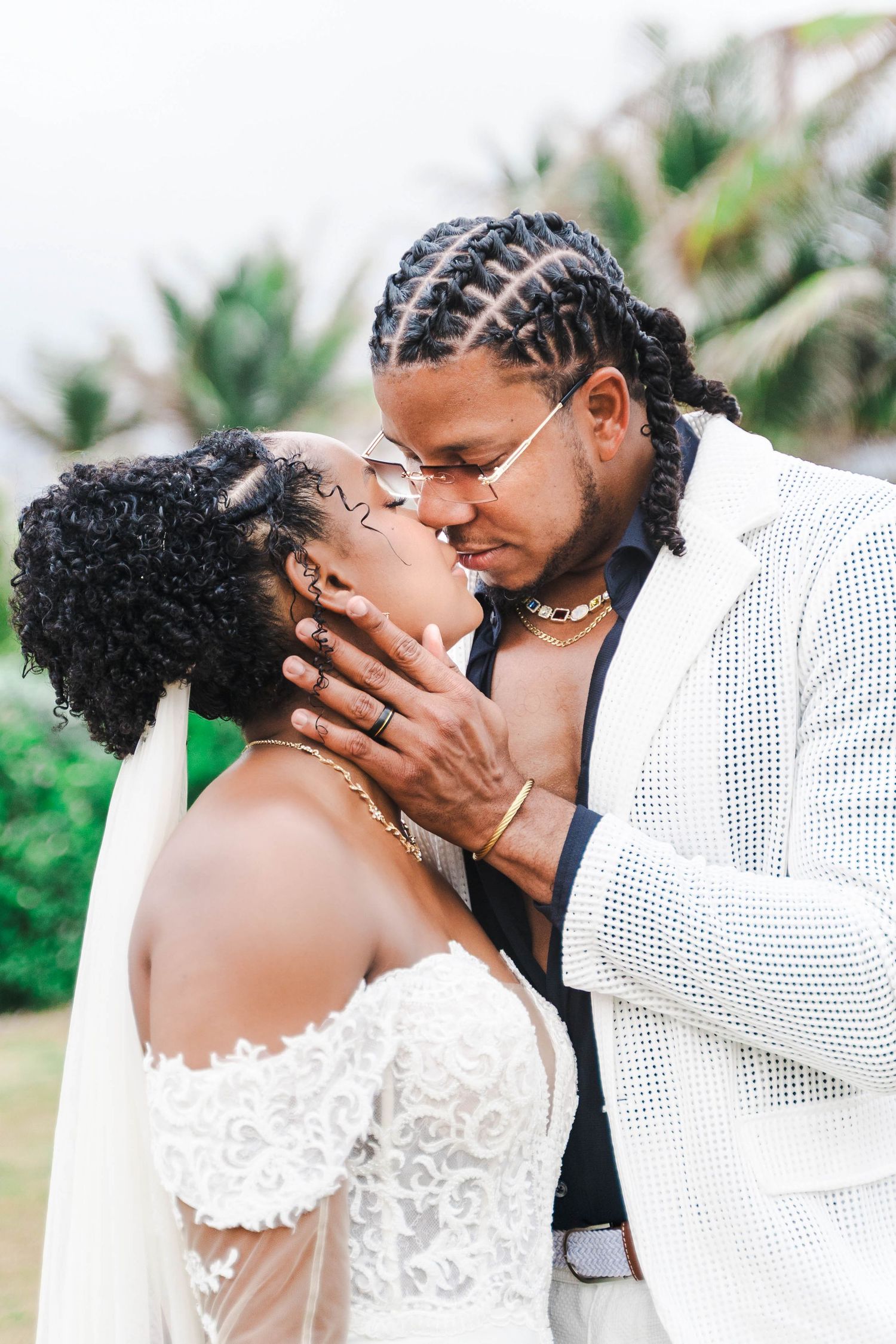 Romantic wedding sequence showing tender moments between newlyweds in white attire.