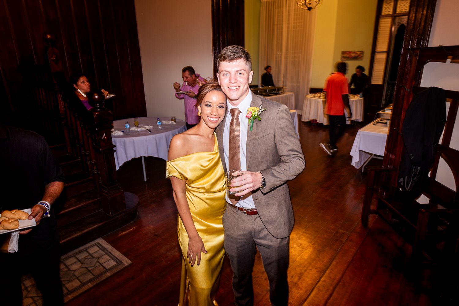 Guests enjoying themselves on a wooden dance floor at an elegant evening reception.
