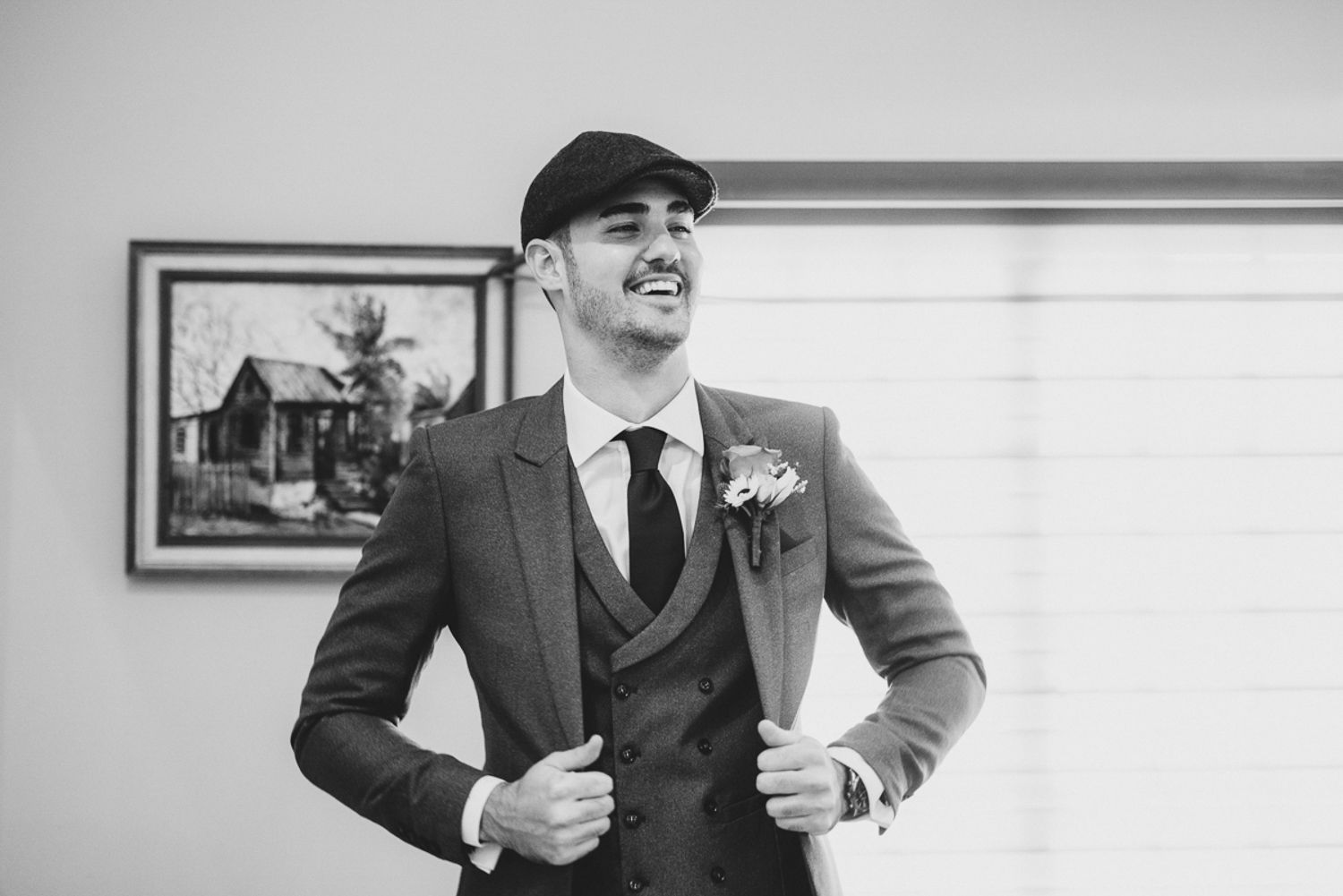 A series of black and white photographs showing formal poses of someone wearing business attire and accessories.