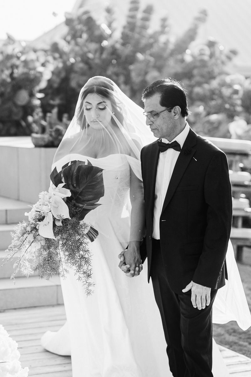 Black and white wedding portraits showing intimate moments between couple.