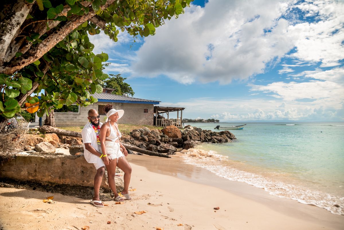 Stunning beachfront panorama with turquoise waters and white sand under blue skies.