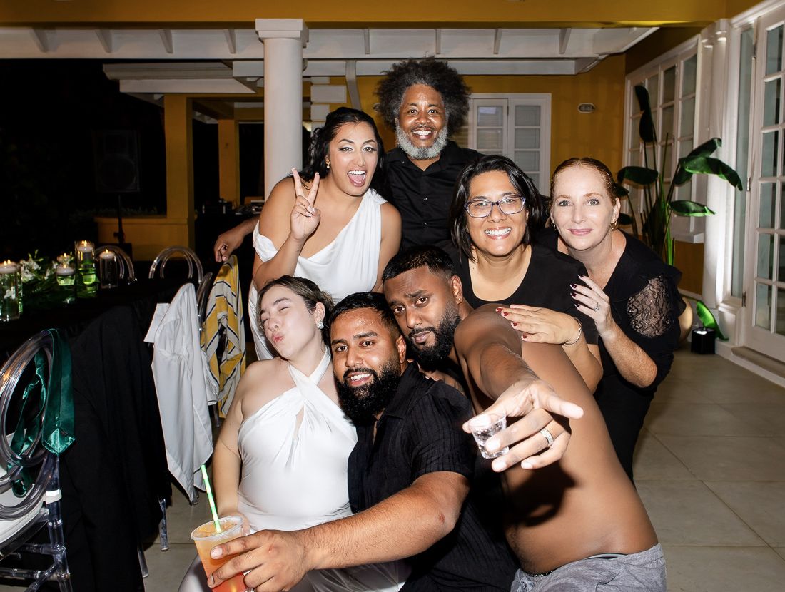 Group celebration photo with friends showing excitement and joy at party.