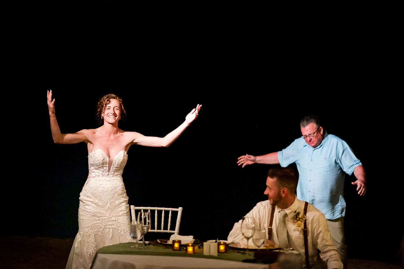 Candid moments from a beachside wedding reception with guests dancing.