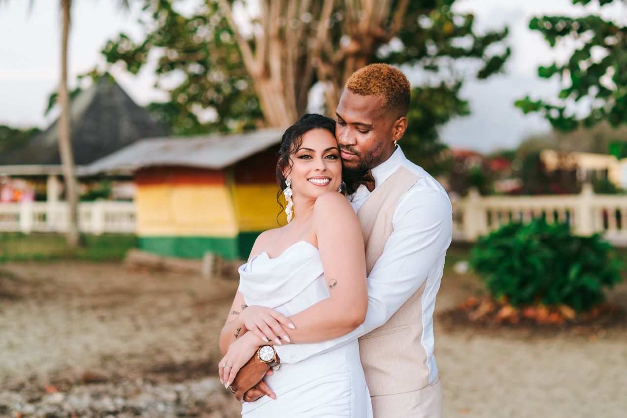 A romantic beach wedding photoshoot with white and tropical scenery.