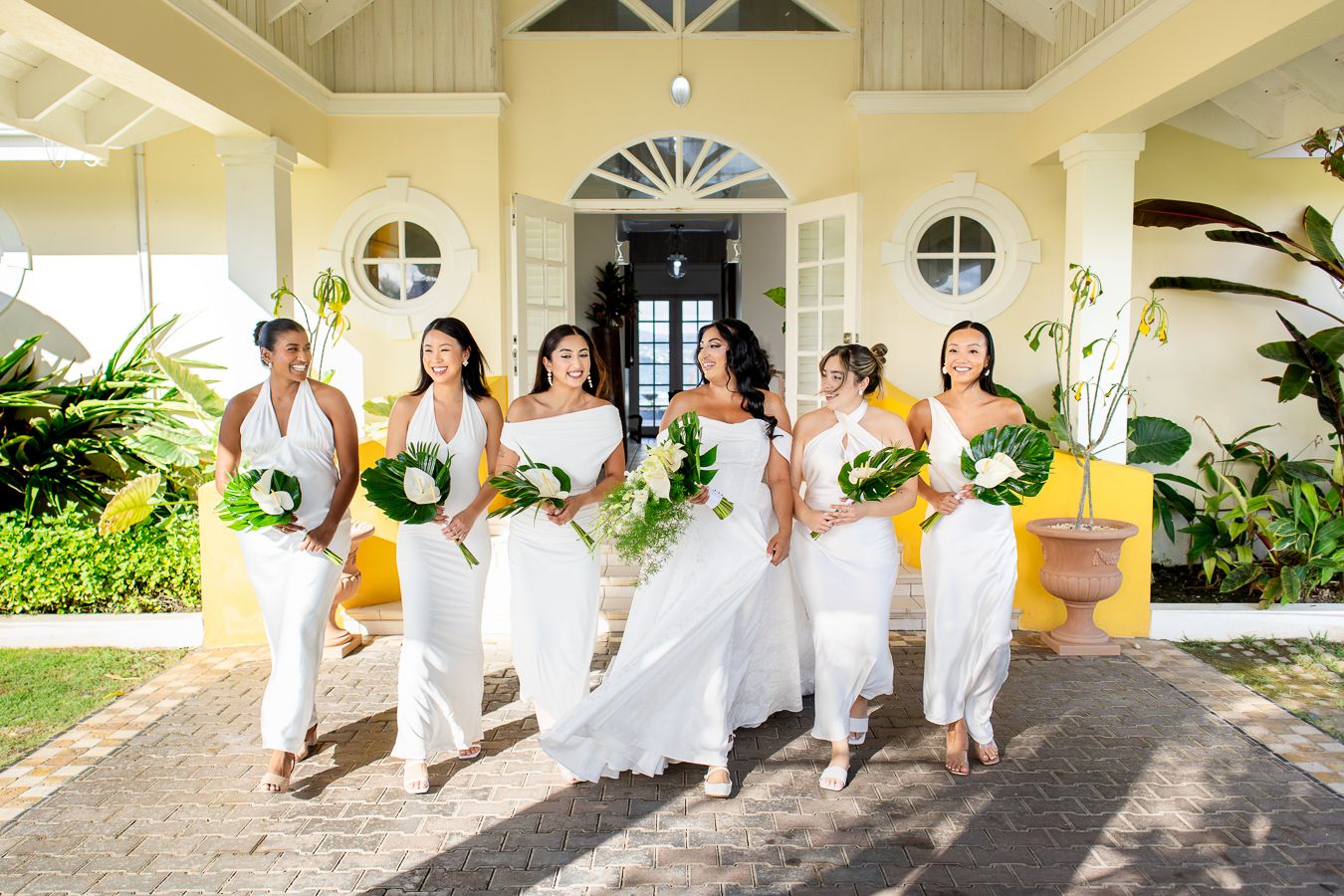 Bride and Bridesmaids walking candidly at a tropical villa in the caribbean,