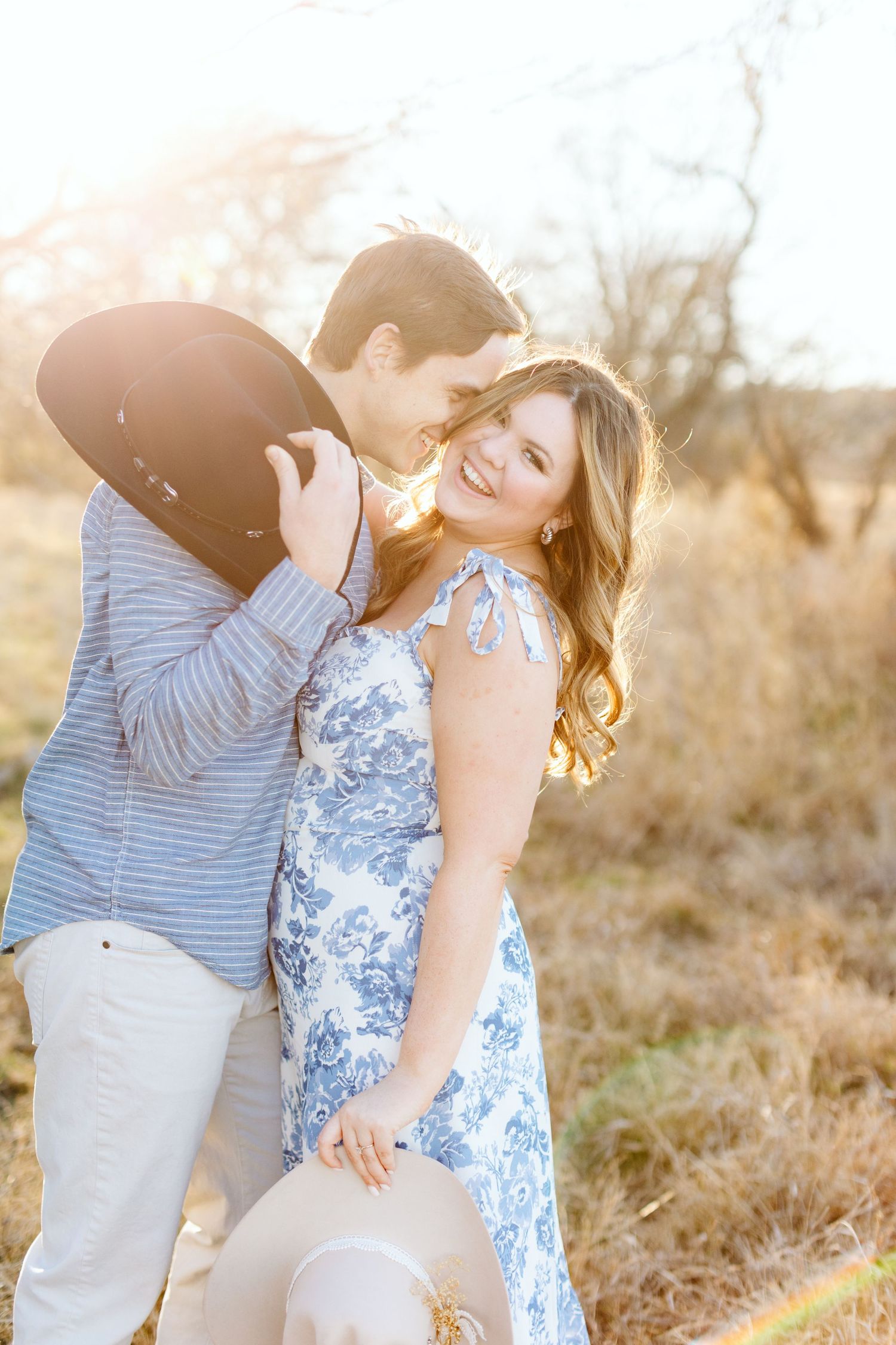 Golden hour engagement session with cowboy hats, best engagement photographer in Fort Worth, affordable engagement photographer DFW