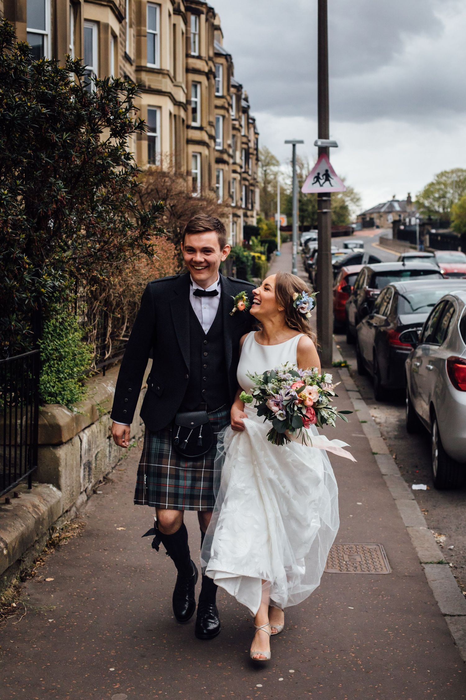 bride and groom laughing during relaxed wedding moment