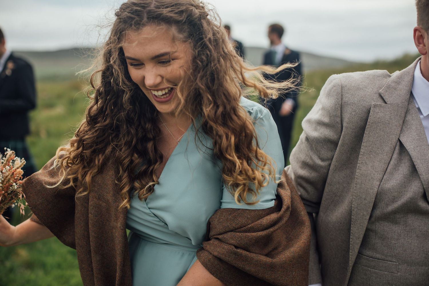bridesmaid captured laughing, soft, imperfect film photograph from wedding day