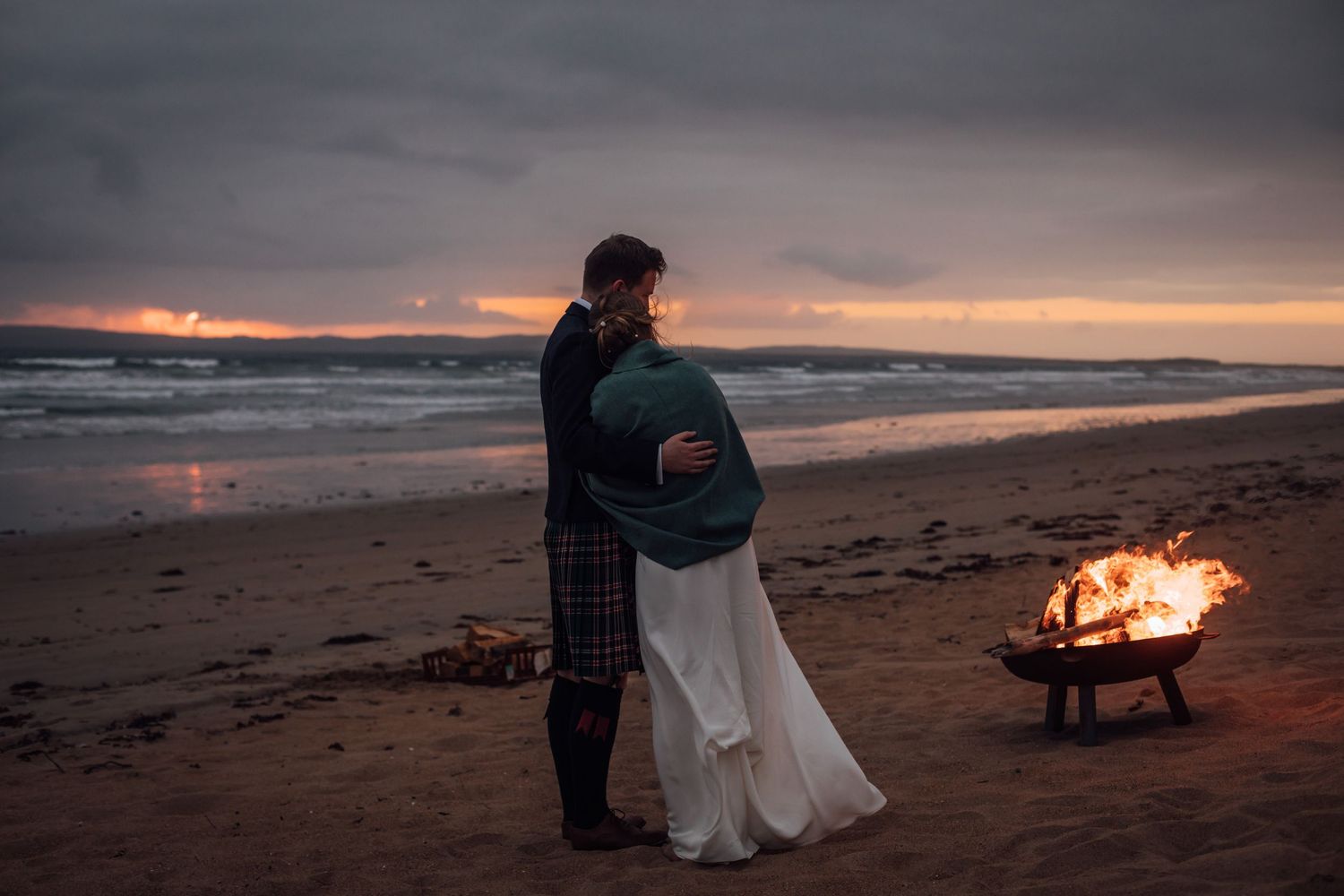couple exploring rugged coastline after wedding ceremony