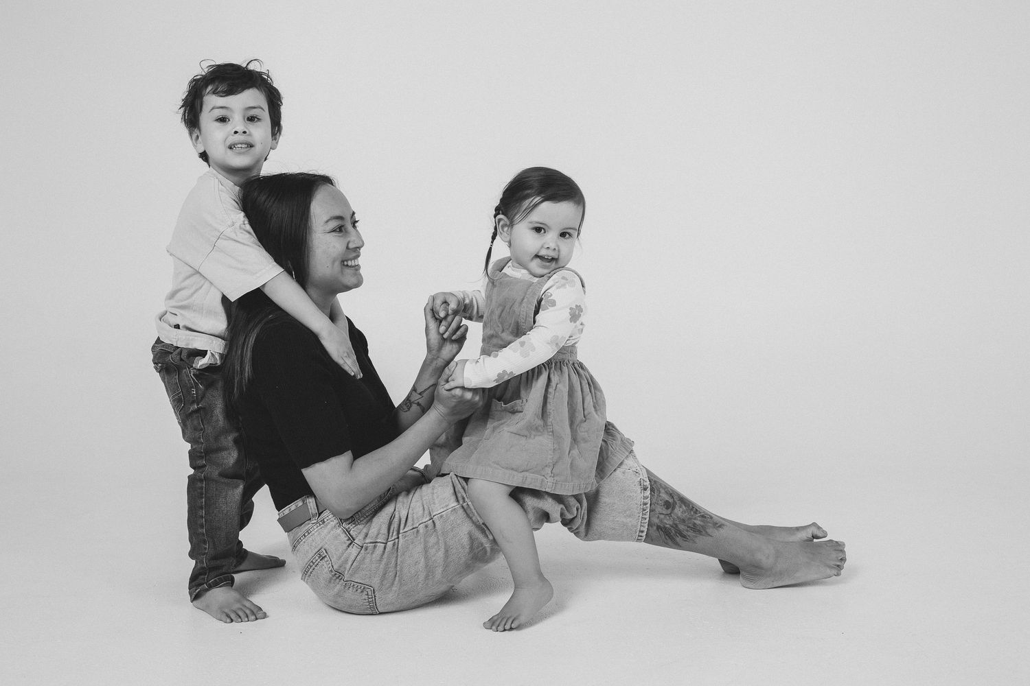 Black and white studio sequence capturing candid family moments.