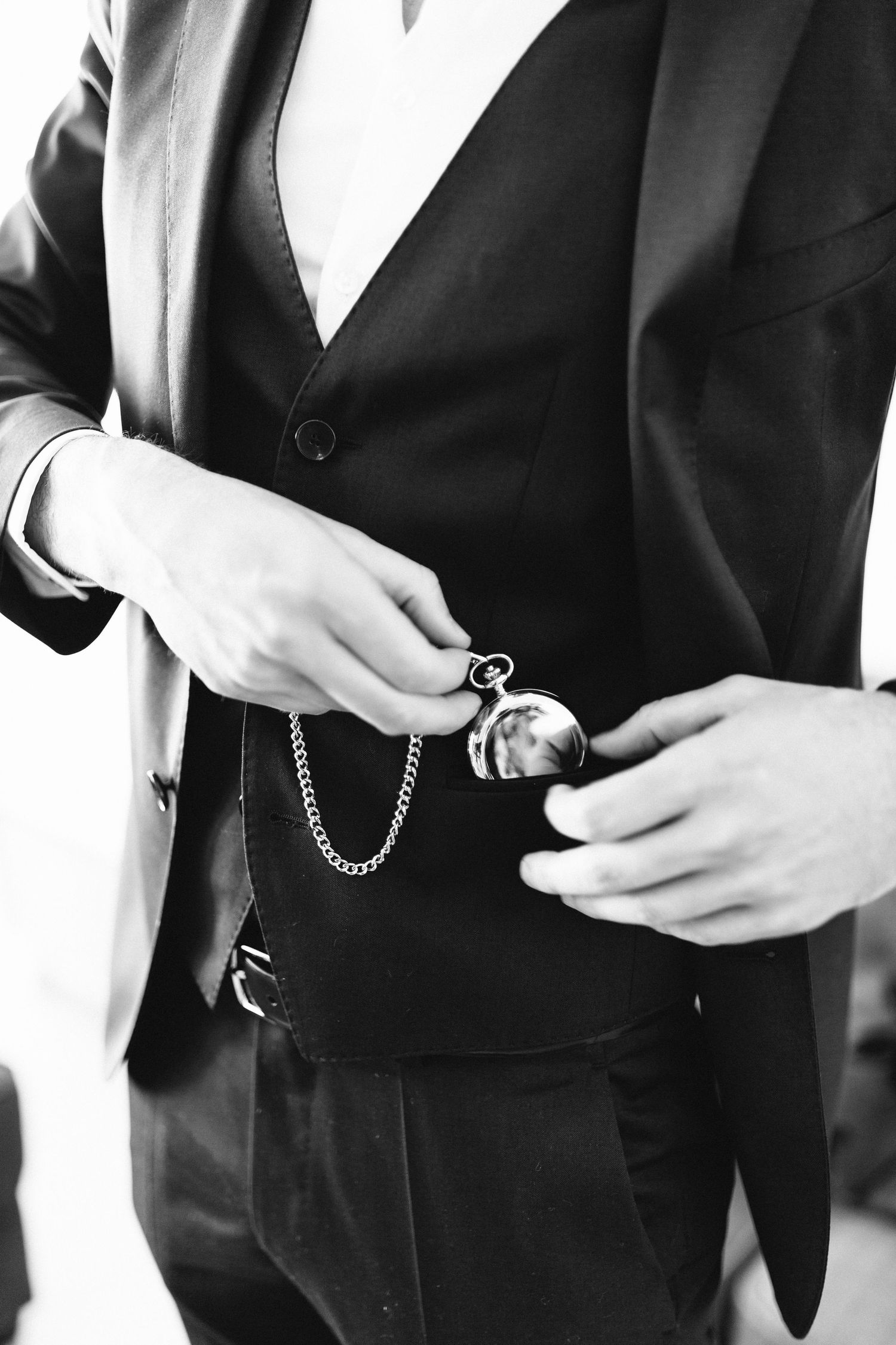 Detail shots of formal black and white attire with pocket watch accessories.
