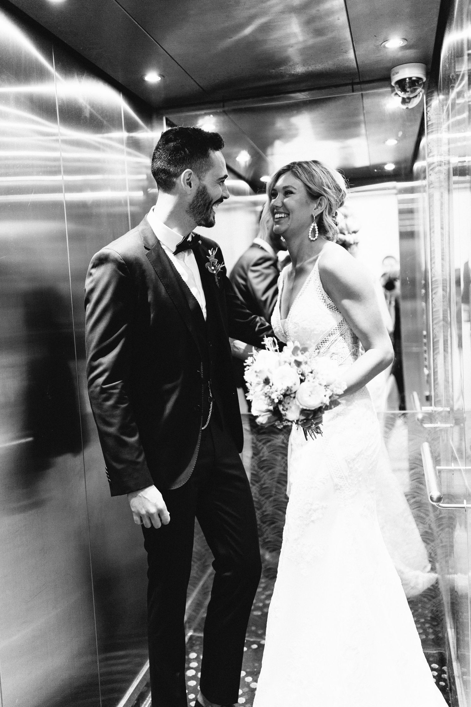 Sequence of romantic moments in an elevator on a wedding day.