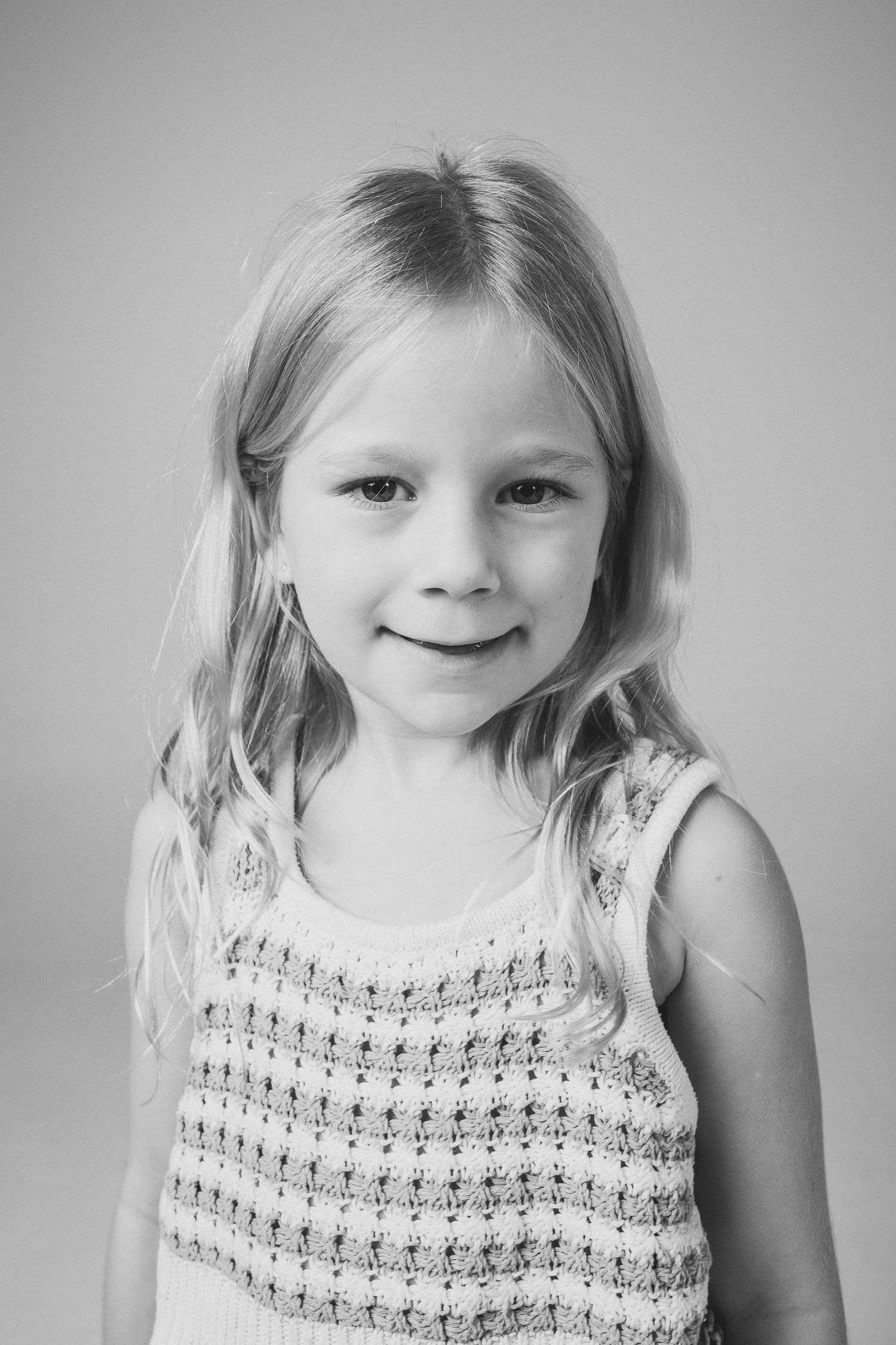 Series of close-up portraits showing expressions in delicate lace top.