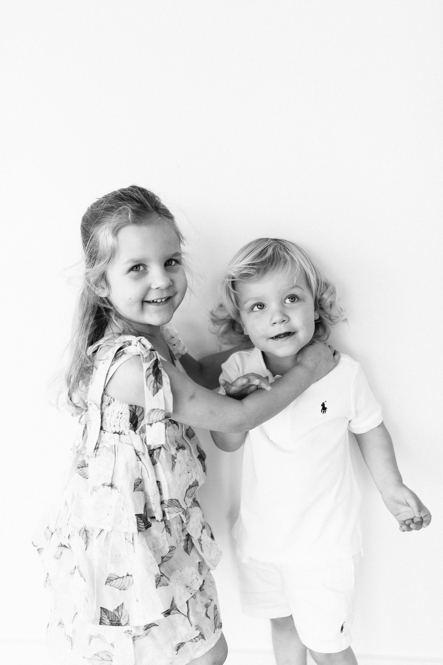 Playful black and white family portraits with floral dress details.