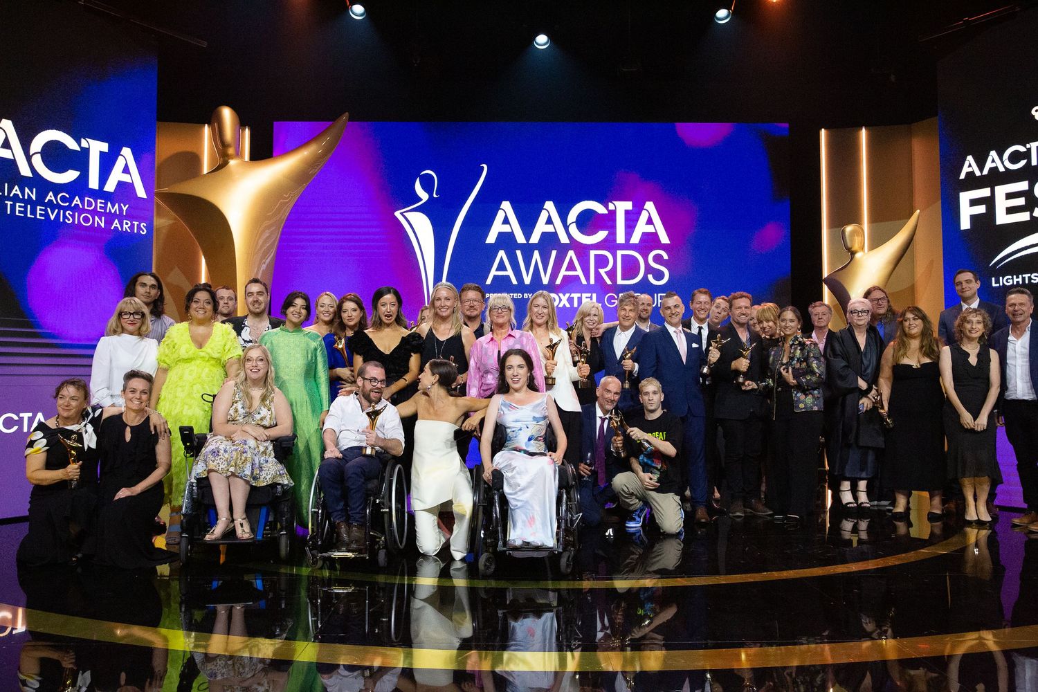 Large group photo of award show attendees at AACTA Awards ceremony.