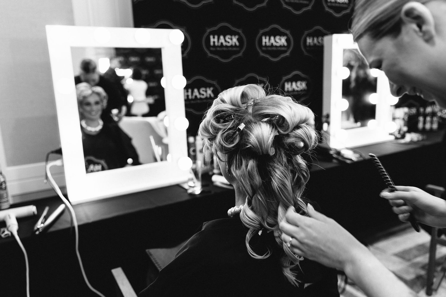 Behind the scenes preparation shots showing hair and makeup styling.