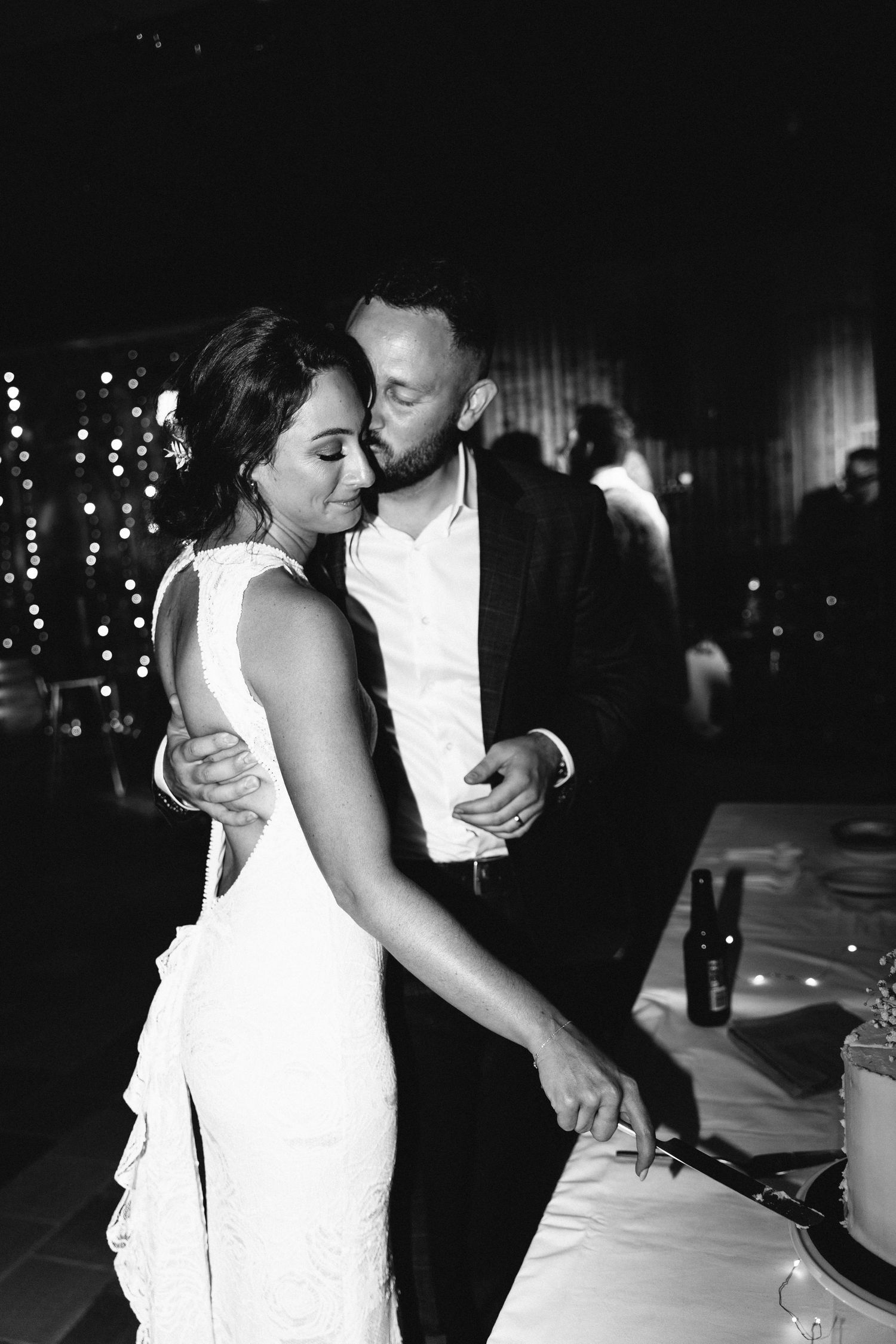 Black and white wedding photos capture intimate dance floor moments between newlyweds.