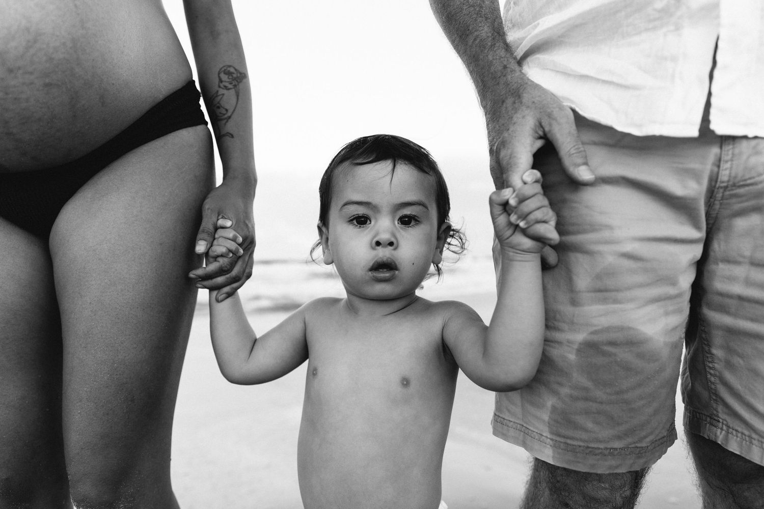 A collection of casual family photos showing torsos and midsections outdoors.