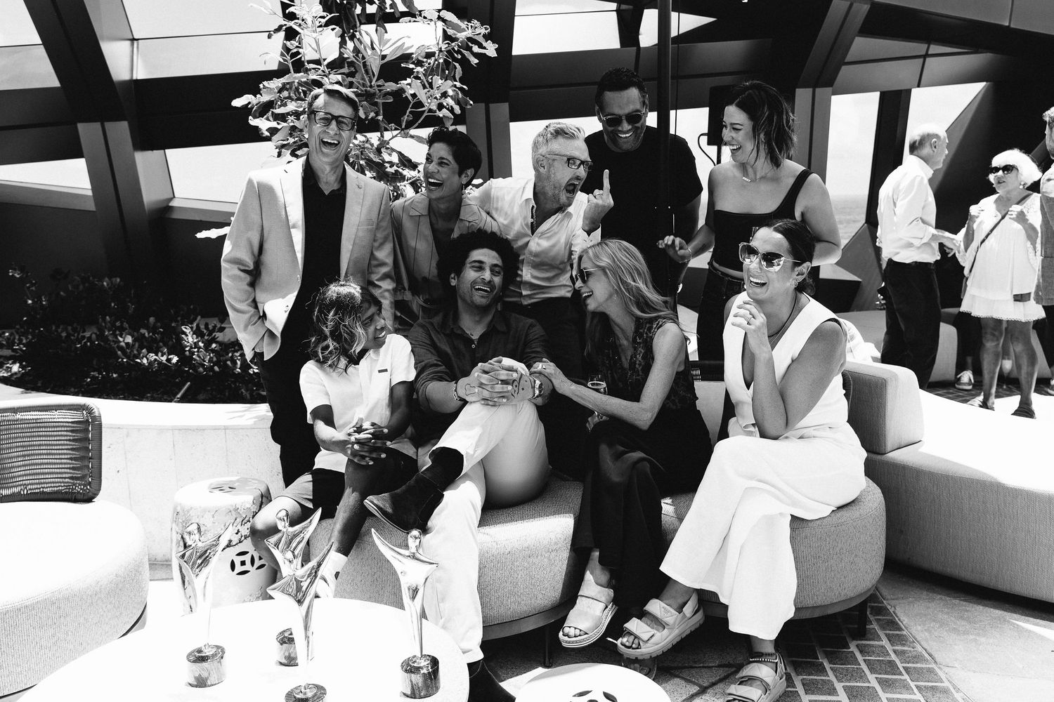 Wedding guests seated at outdoor tables during a daytime celebration.