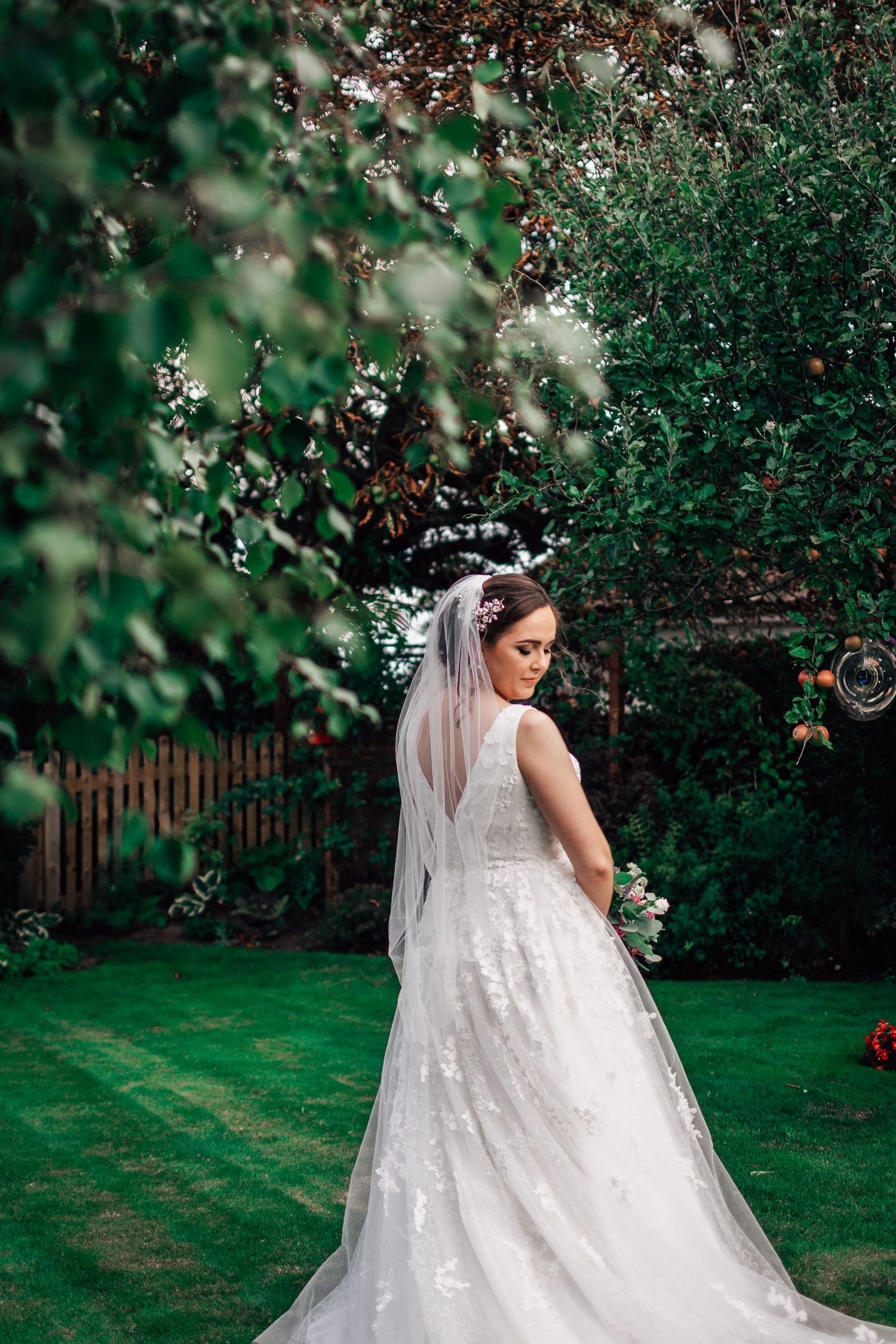 Bride posing in her garden