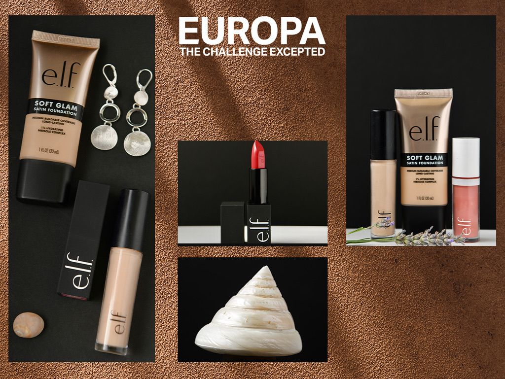 Flatlay of makeup products including foundation, lipstick, earrings and skincare items against a brown background.