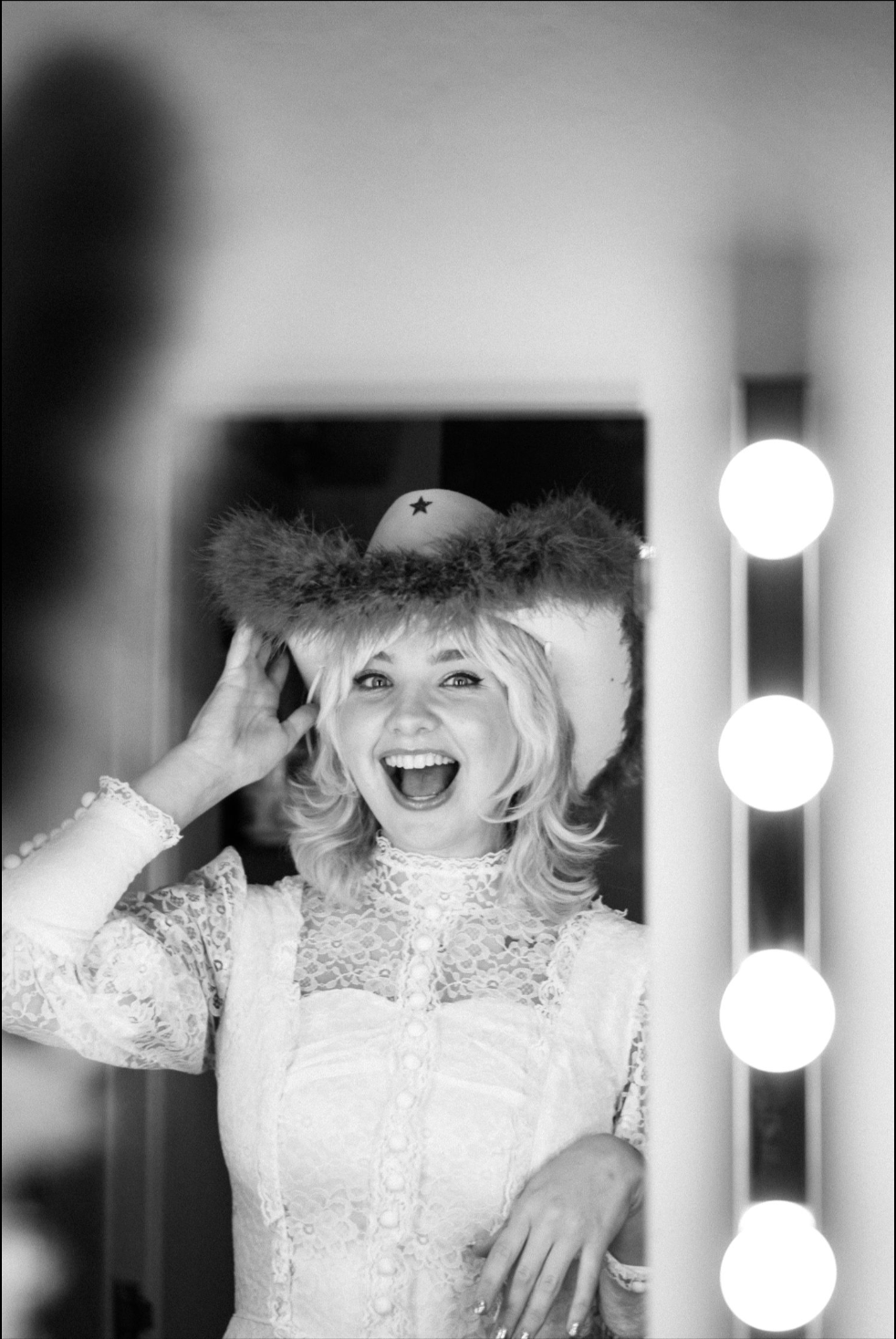Black and white photo sequence of a performer in a lace dress posing dramatically in a dressing room.
