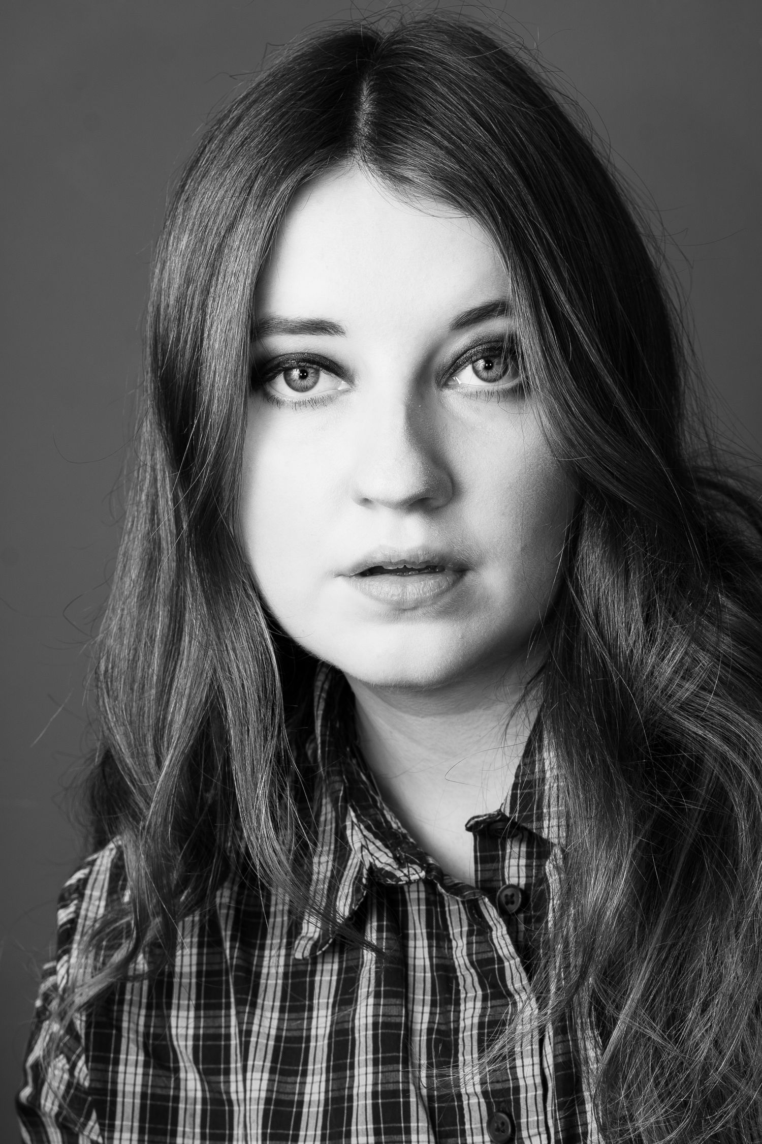 Close-up portrait series in black and white showing emotional expressions and natural styling.