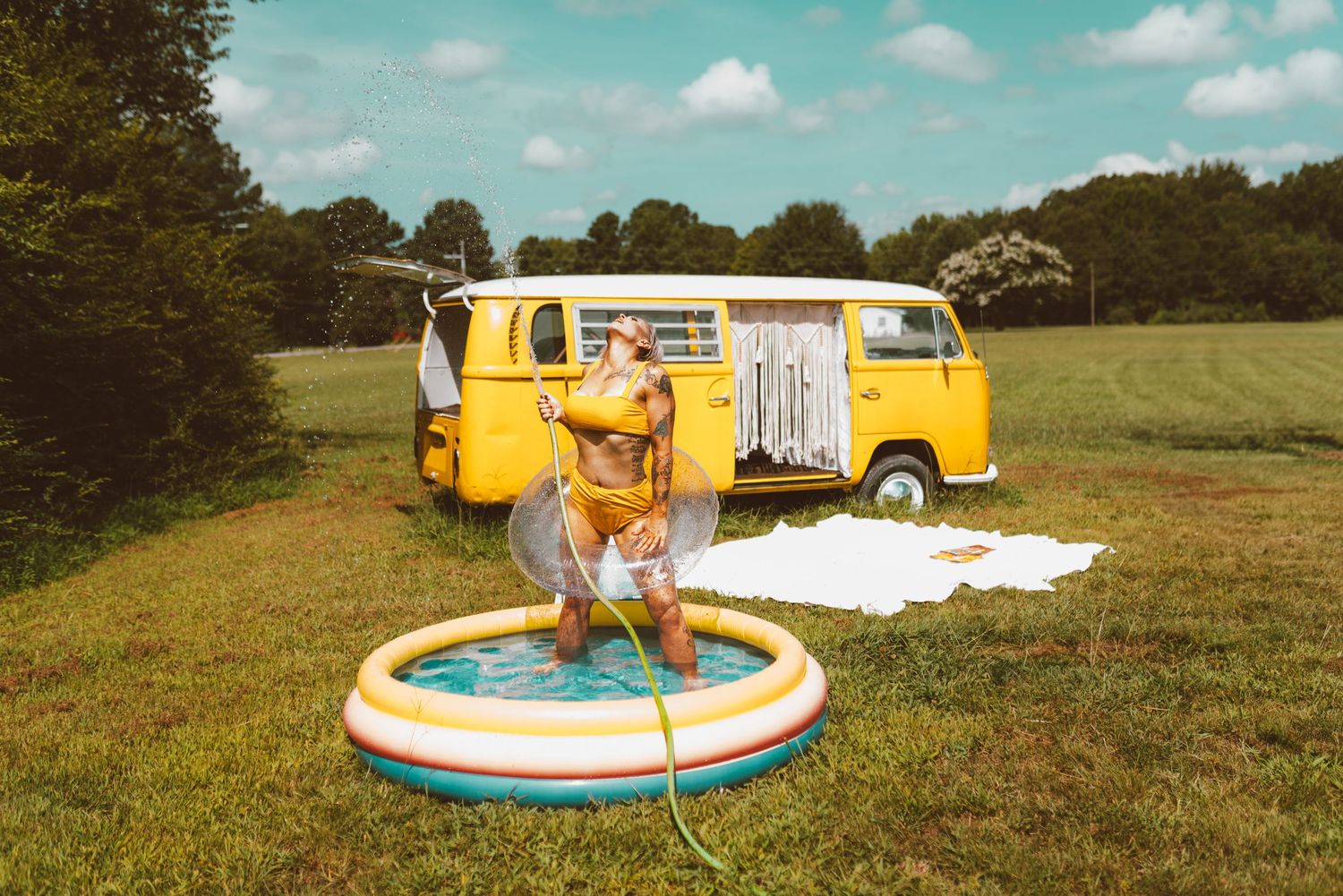 A sequence of vintage-style photos showing an inflatable pool being filled and enjoyed on a sunny summer day.