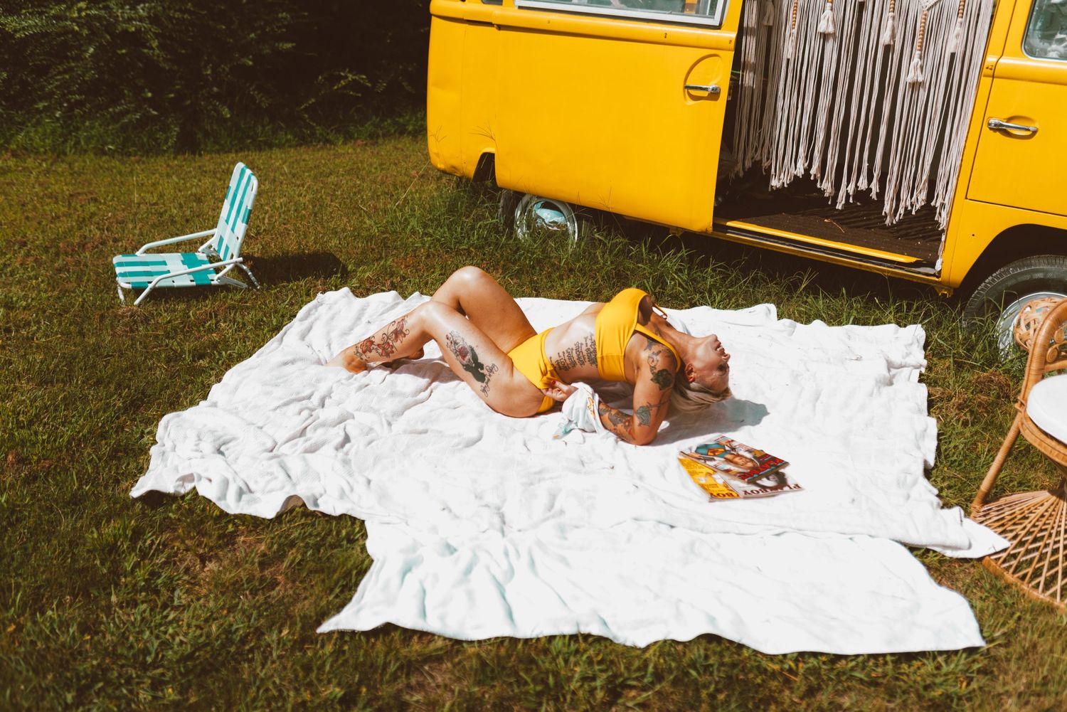 A sequence of images showing a person laying on a white blanket outdoors next to yellow and blue objects.