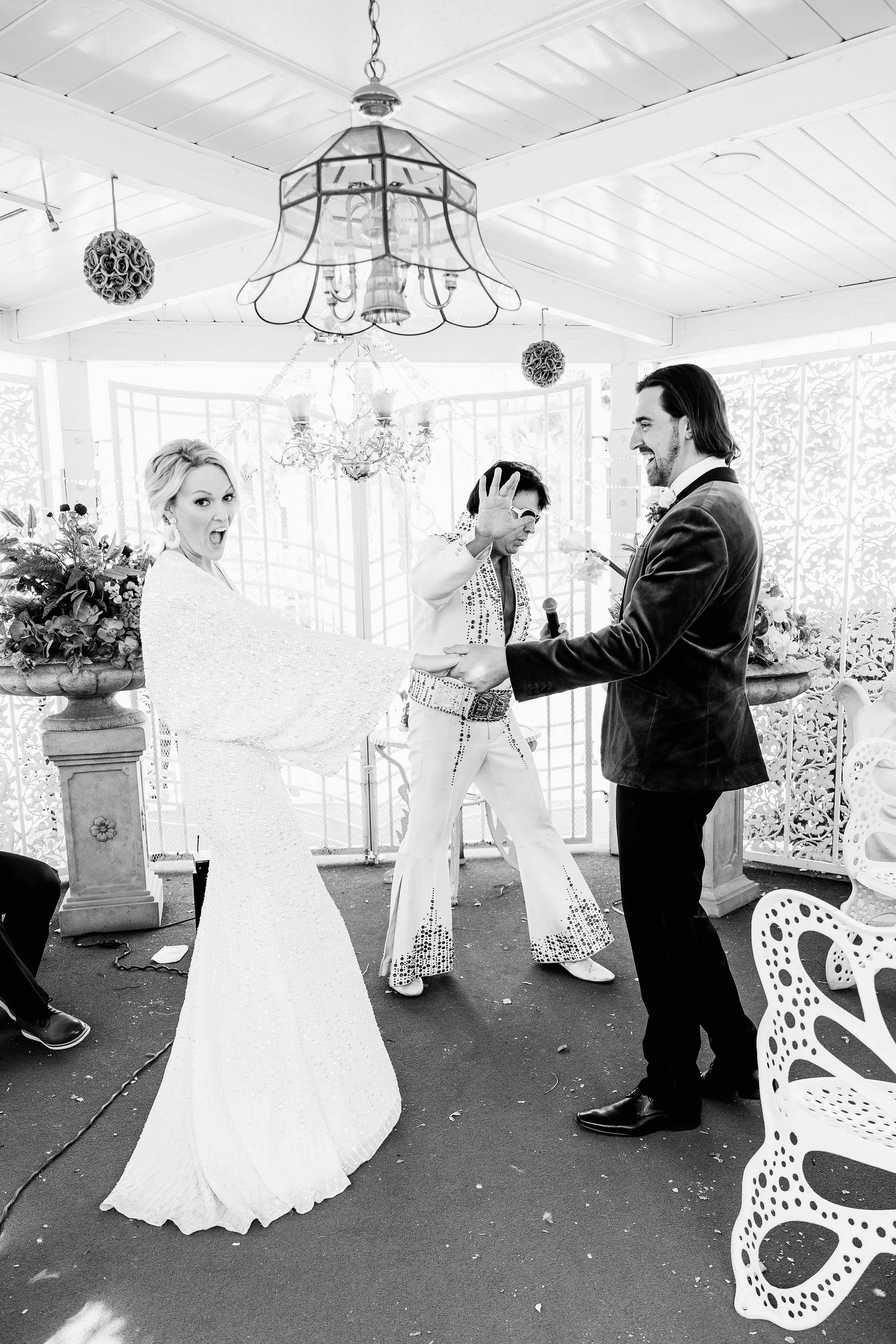 Wedding first dance sequence showing couple dancing in an elegant white reception room.