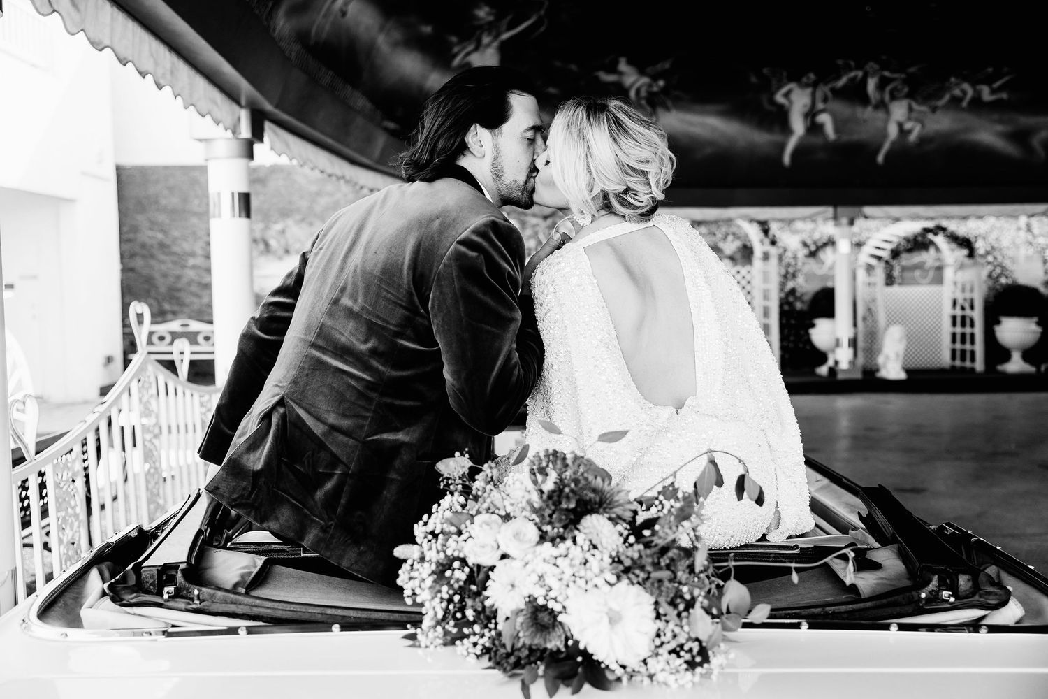 A sequence of black and white wedding photos showing intimate moments and celebrations.