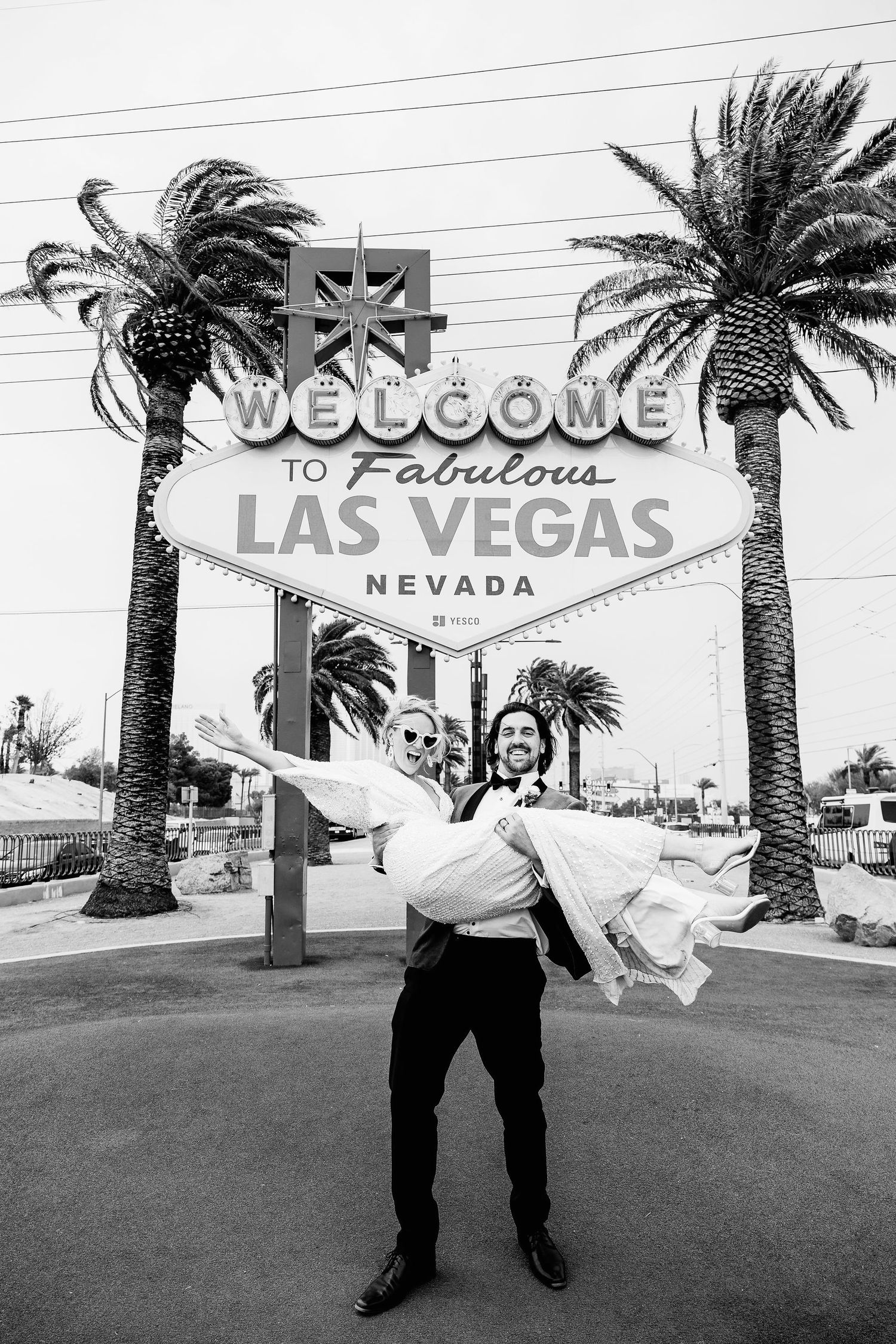 Series of black and white photos taken in front of the iconic Welcome to Las Vegas sign.