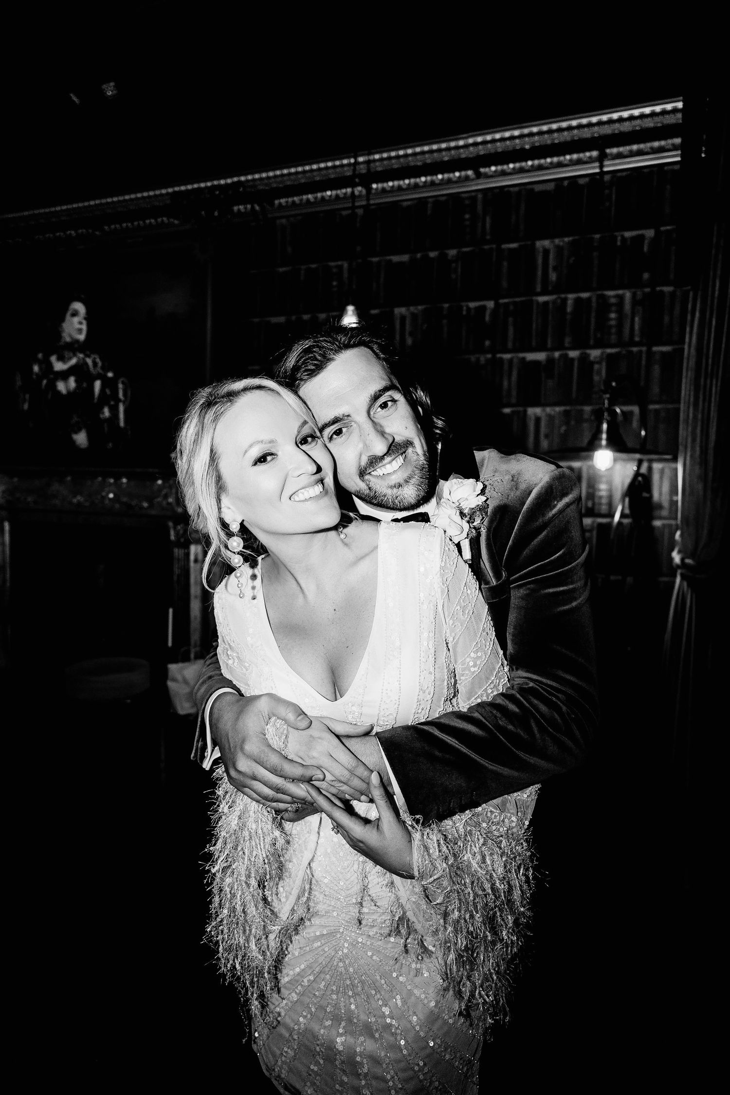 Romantic black and white photos showing a couple sharing tender moments in a dimly lit setting.