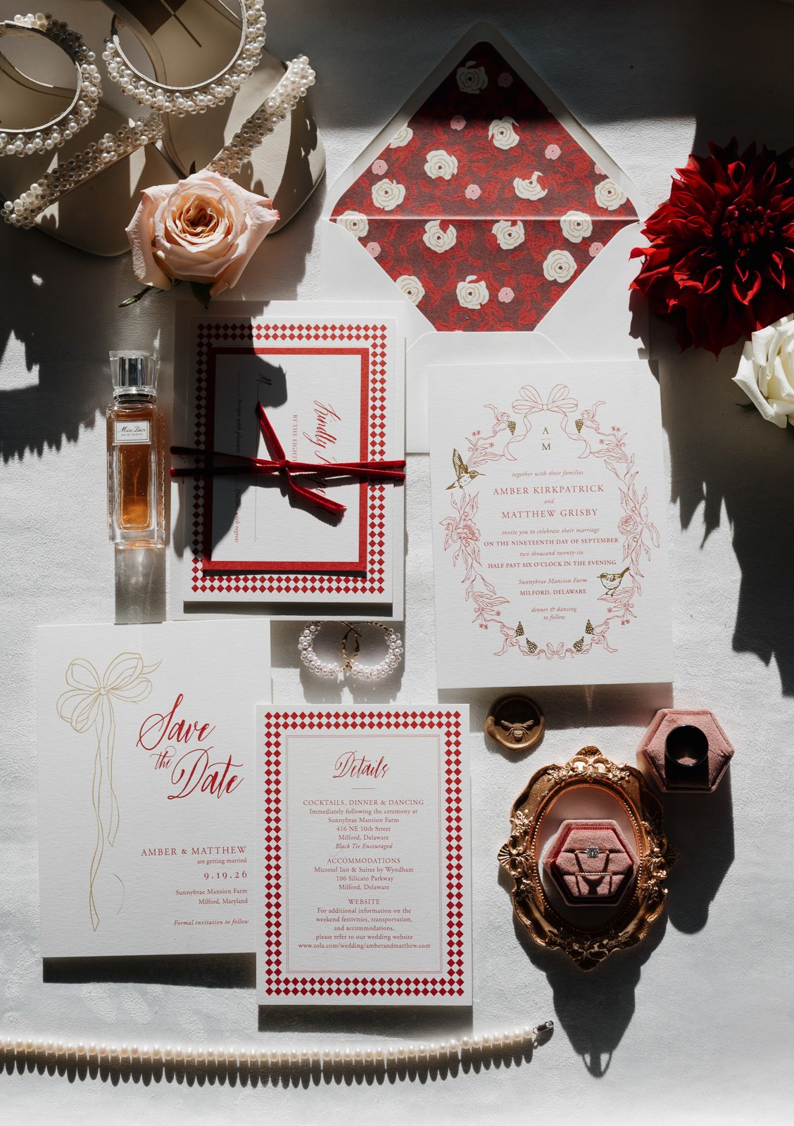 Red and white wedding invitation suite with gingham pattern and floral details taken by a South Jersey wedding photographer.