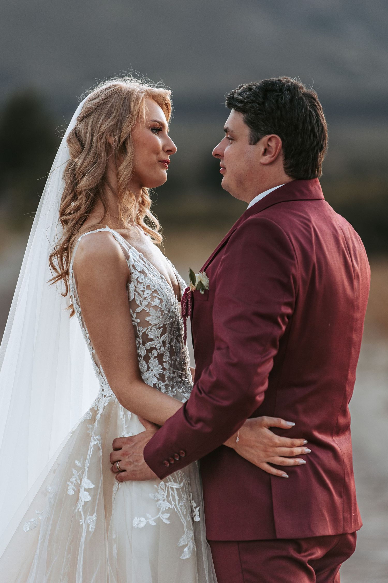 Intimate wedding portrait capturing tender moment between couple.