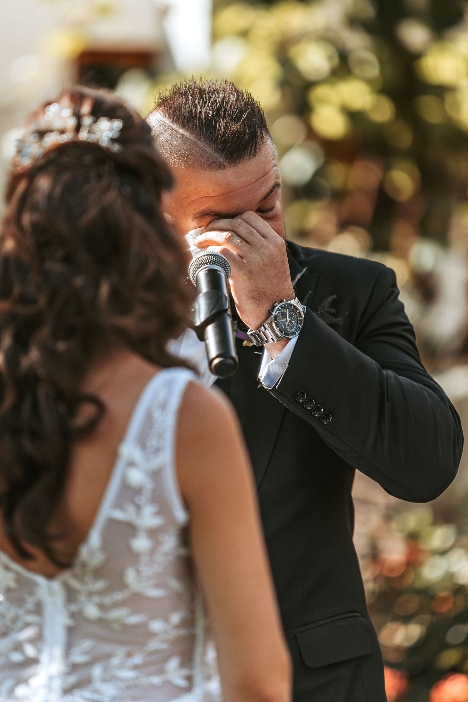 Close-up shots of wedding ceremony moments with bride in lace dress and groom in black suit.