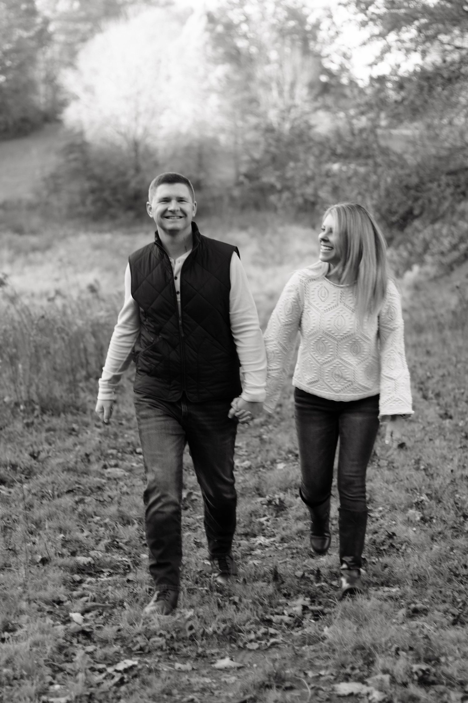 Black and white photo sequence of couple walking together through autumn field.