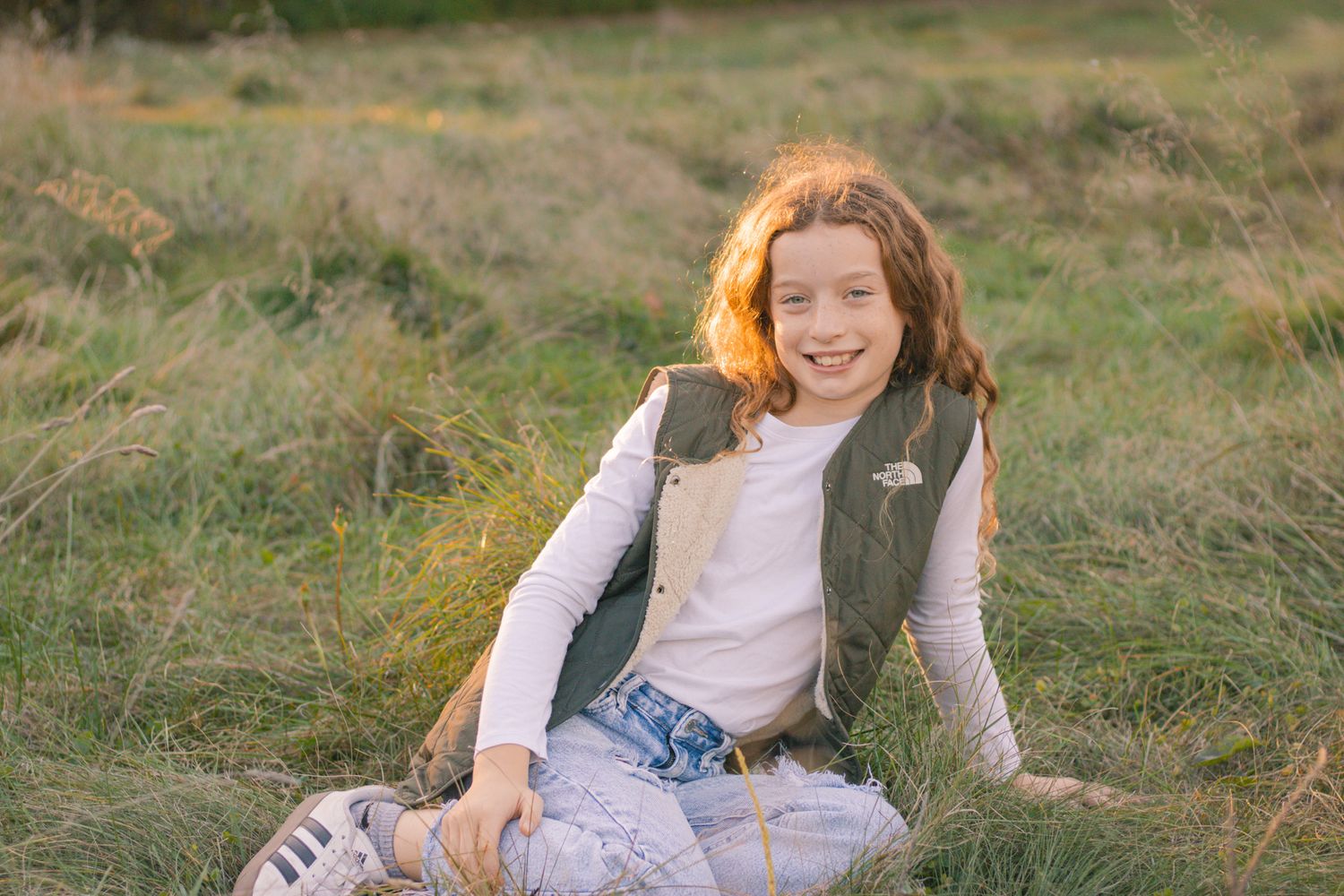 Natural outdoor portrait session in rustic field setting at the Ledges during golden hour.