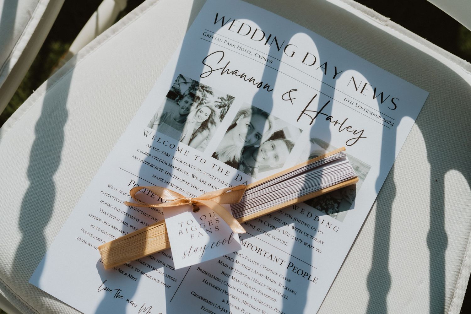 Wedding invitation suite with ribbon detail photographed in natural sunlight.
