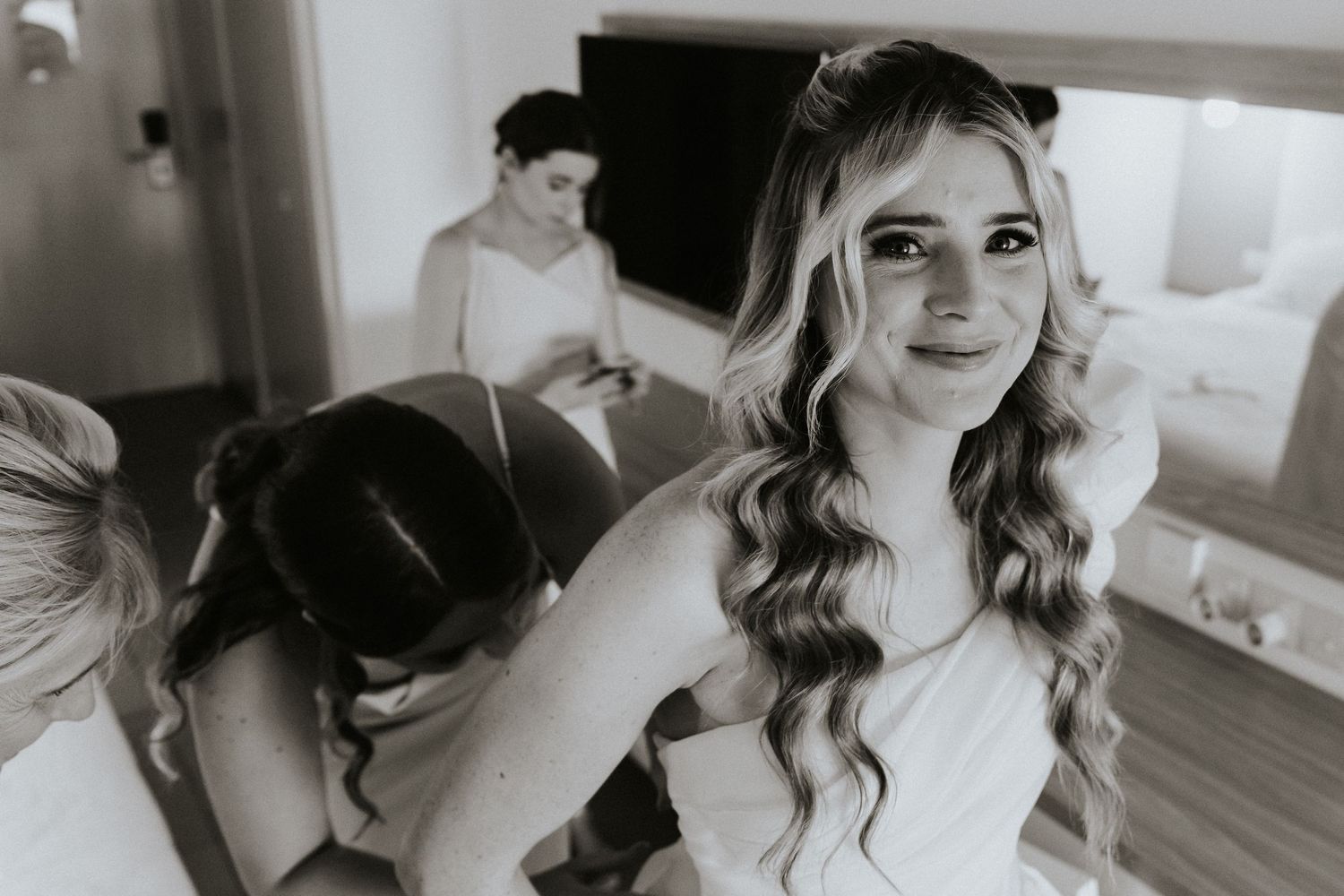 Artistic black and white photo capturing wedding day preparations.