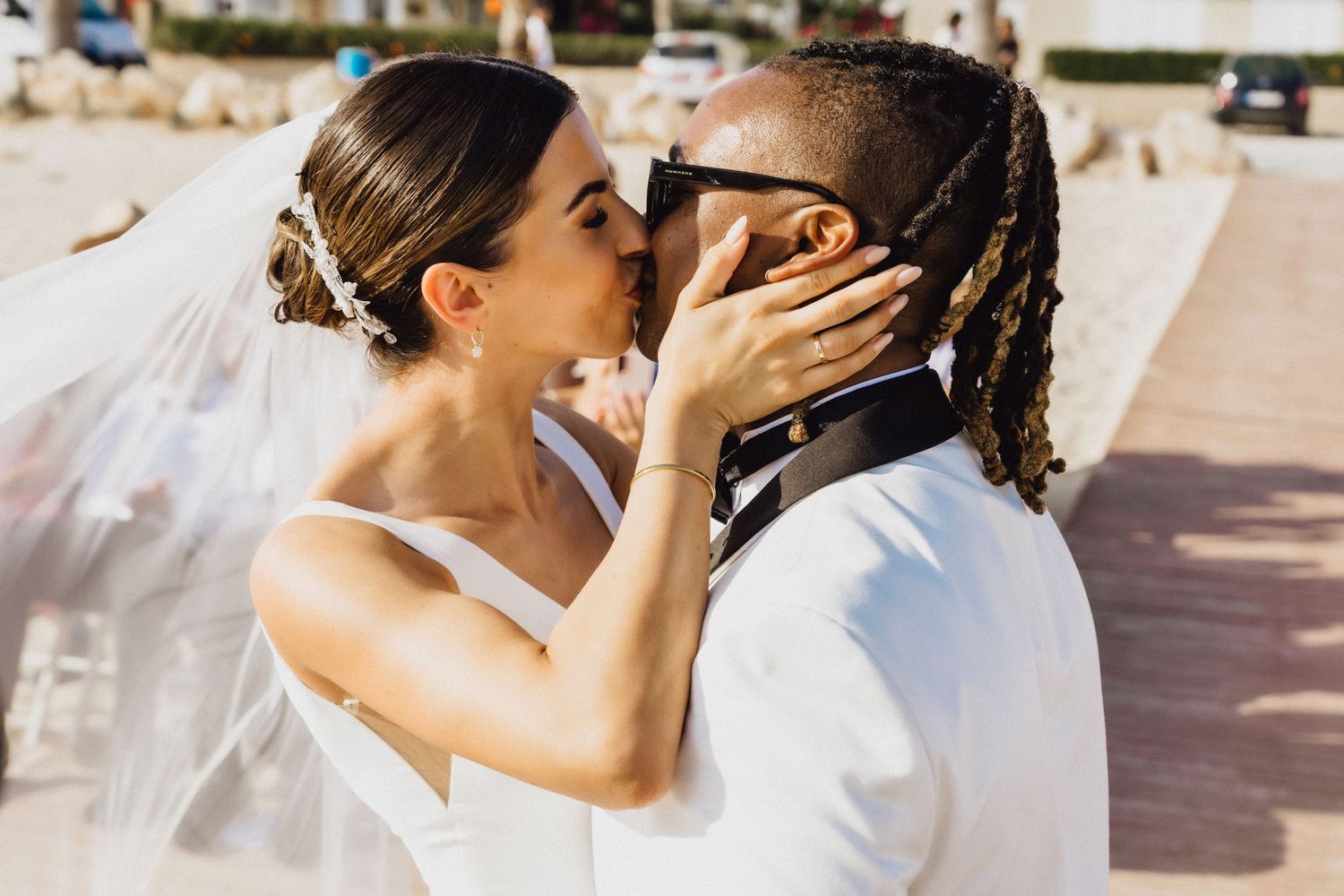 Intimate moment between newlyweds during their beach wedding ceremony.