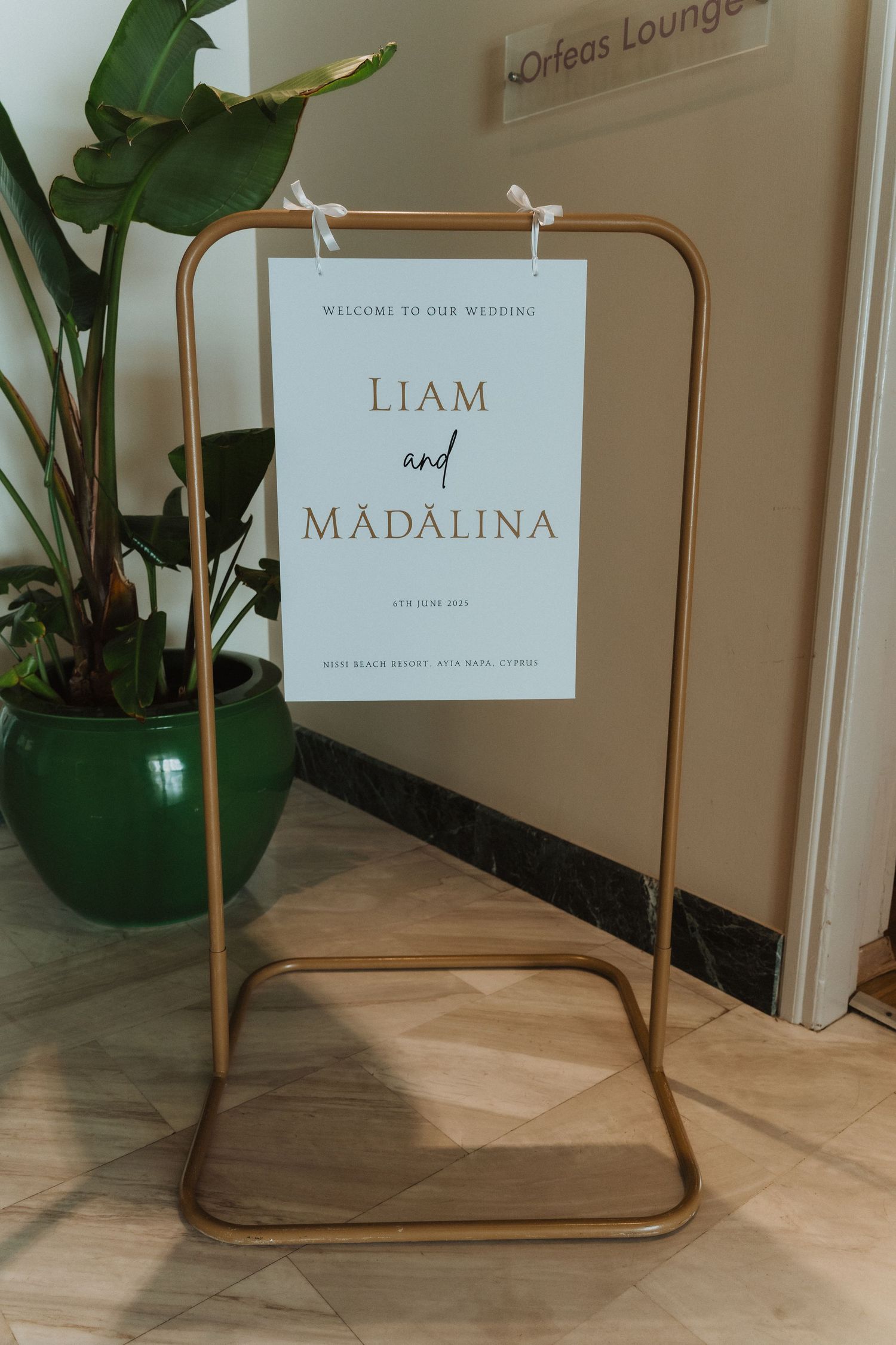 Elegant gold wedding welcome sign for Liam and Madalina's ceremony.