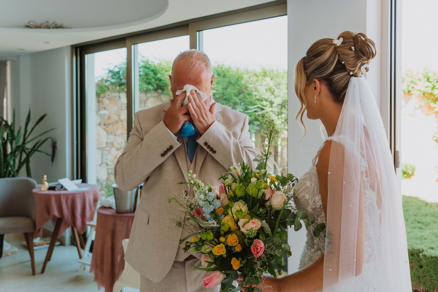 A collection of candid wedding moments showing emotional reactions and floral arrangements in a light-filled setting.