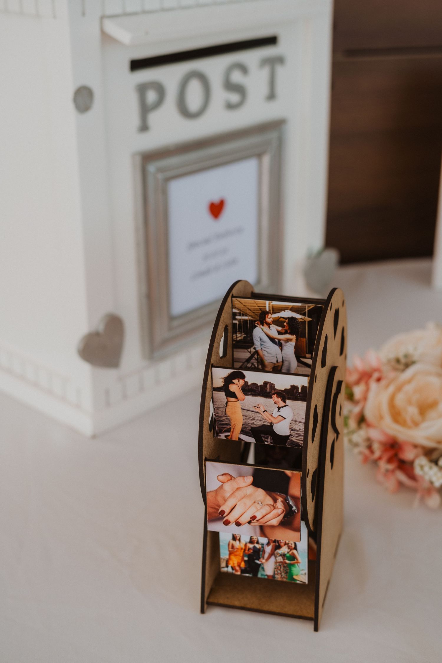 Vintage-style white post box with heart detail and wooden photo display holder.